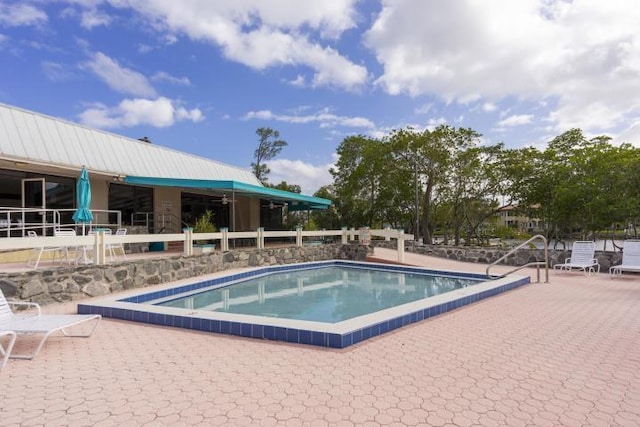 view of pool featuring a patio area