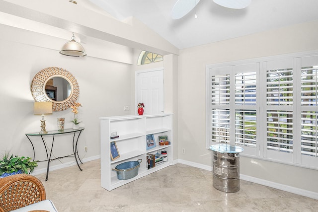 interior space featuring lofted ceiling and ceiling fan