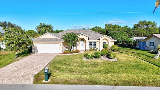 ranch-style home with a garage and a front yard