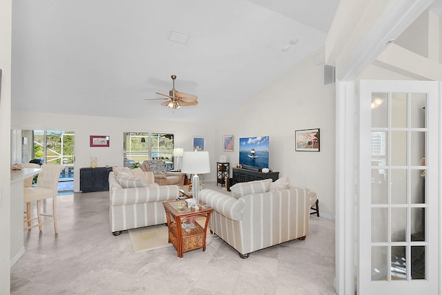 living room featuring ceiling fan and lofted ceiling