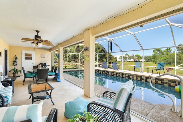 exterior space with ceiling fan, outdoor lounge area, a patio area, and glass enclosure