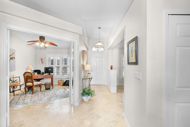 entryway featuring ceiling fan