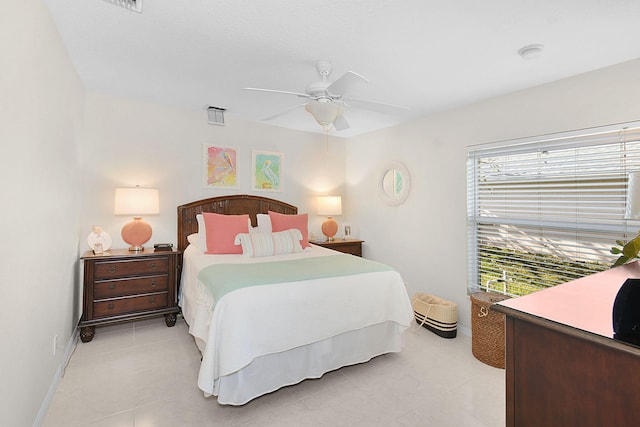 tiled bedroom with ceiling fan