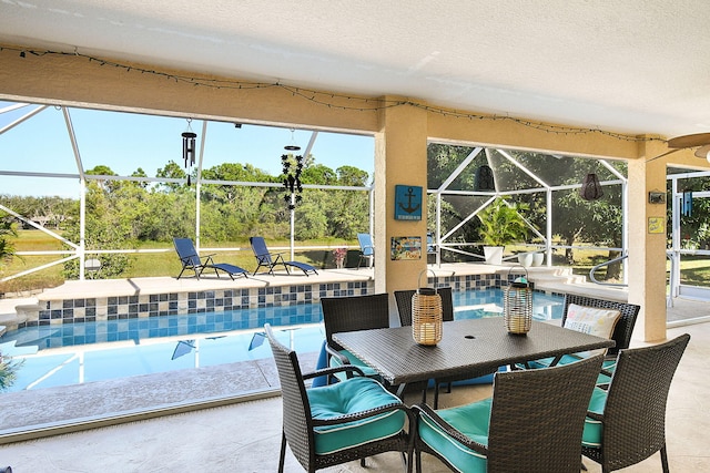 view of pool featuring a lanai and a patio