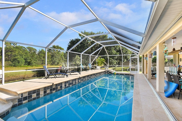 view of pool featuring a lanai and a patio area