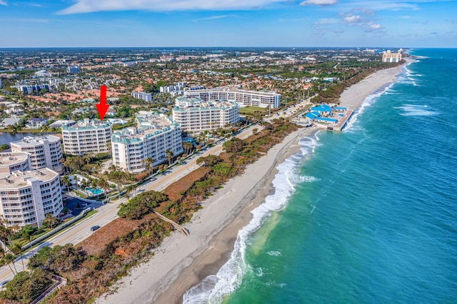 aerial view with a water view and a view of the beach