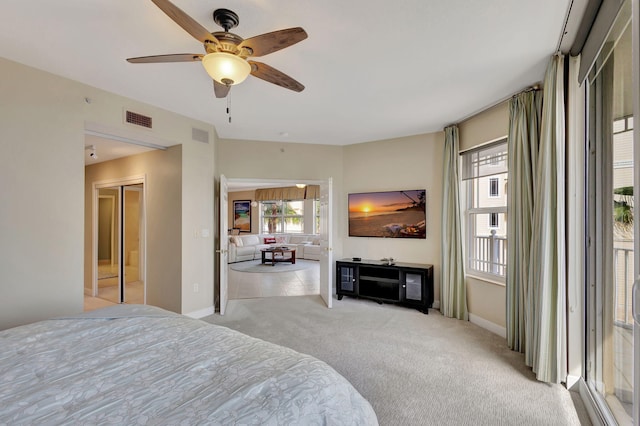 bedroom featuring light colored carpet and ceiling fan