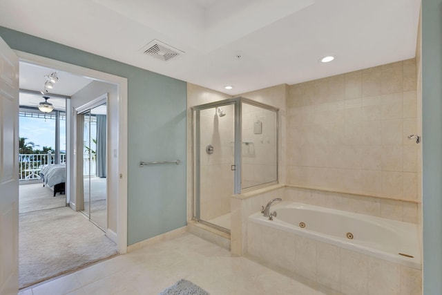 bathroom featuring plus walk in shower and tile patterned flooring