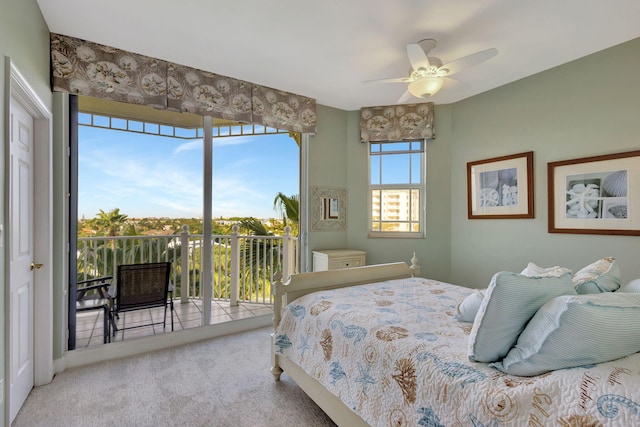 bedroom with carpet, ceiling fan, and access to outside