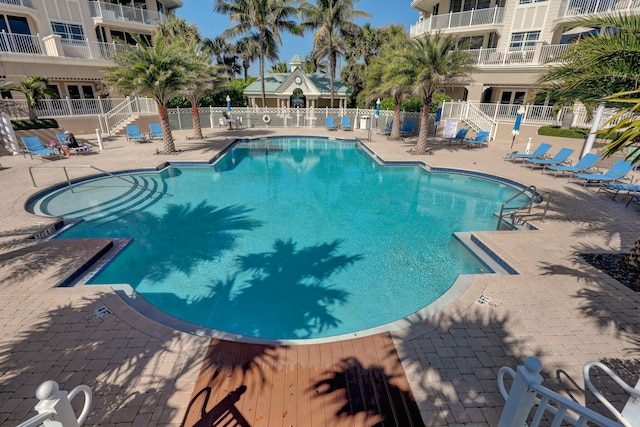 view of swimming pool with a patio