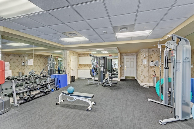 workout area with carpet and a drop ceiling