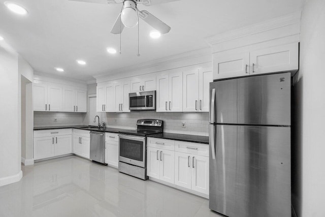 1701 Vision Dr, Palm Beach Gardens, FL 33418 - kitchen featuring appliances with stainless steel finishes, crown molding, a sink, backsplash, and dark countertops