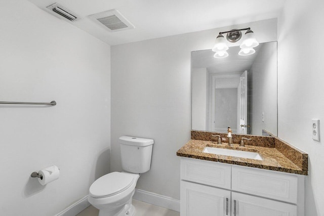 1701 Vision Dr, Palm Beach Gardens, FL 33418 - half bathroom with toilet, vanity, and baseboards
