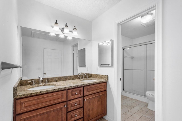 1701 Vision Dr, Palm Beach Gardens, FL 33418 - full bathroom with a shower stall, double vanity, toilet, and a textured ceiling
