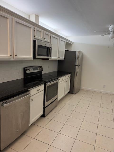 kitchen with white cabinetry, light tile patterned floors, stainless steel appliances, and ceiling fan