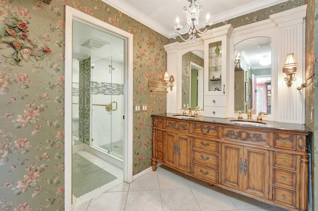 bathroom featuring vanity, tile patterned floors, crown molding, walk in shower, and a notable chandelier