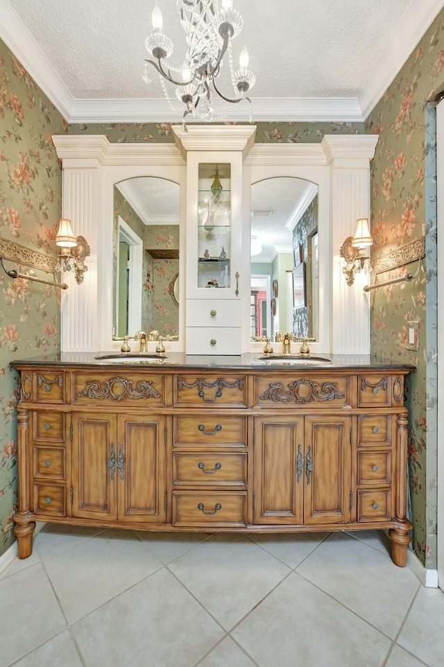 bathroom with crown molding, tile patterned flooring, a chandelier, and a textured ceiling