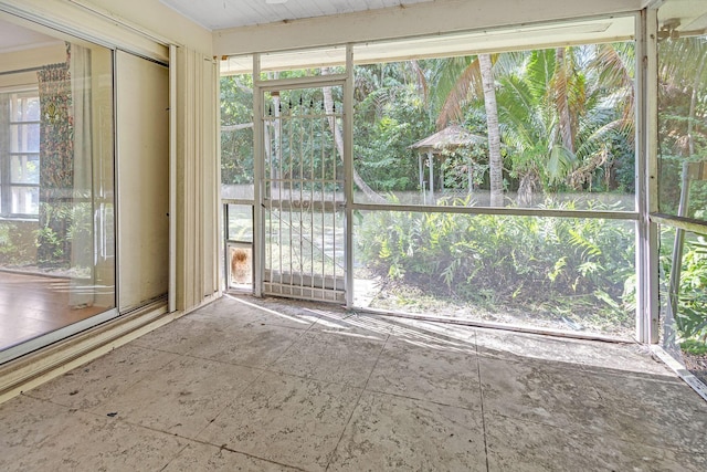 unfurnished sunroom featuring plenty of natural light