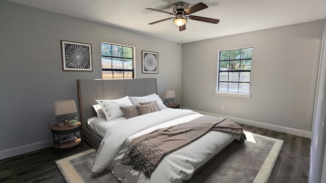 bedroom with multiple windows, ceiling fan, and dark hardwood / wood-style floors