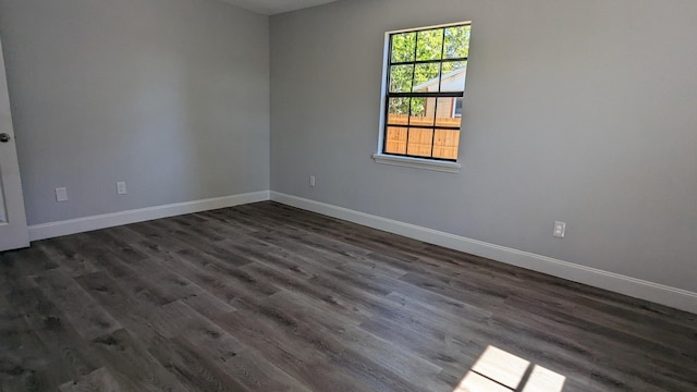 spare room featuring dark hardwood / wood-style floors