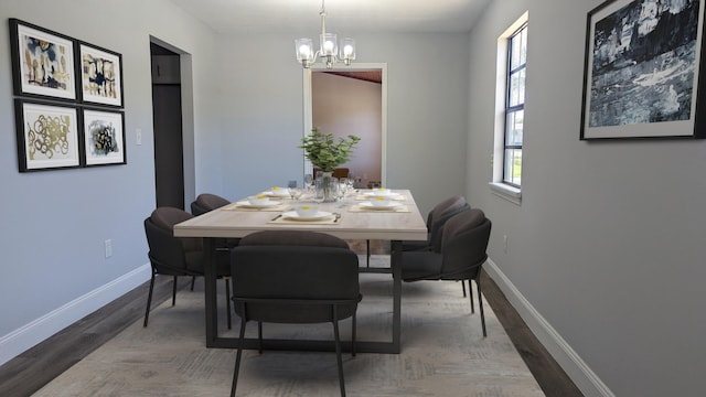 dining area featuring hardwood / wood-style floors, an inviting chandelier, and a wealth of natural light