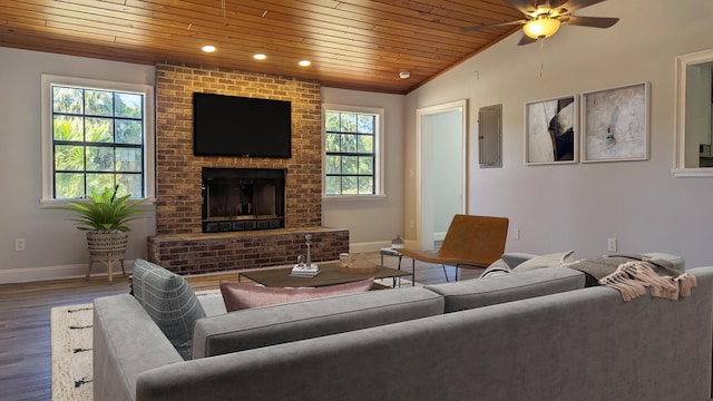 living room featuring hardwood / wood-style floors, a wealth of natural light, wooden ceiling, and ceiling fan