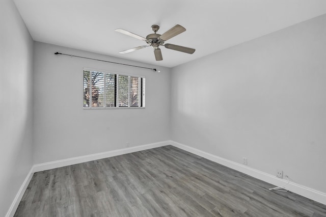 unfurnished room featuring hardwood / wood-style flooring and ceiling fan