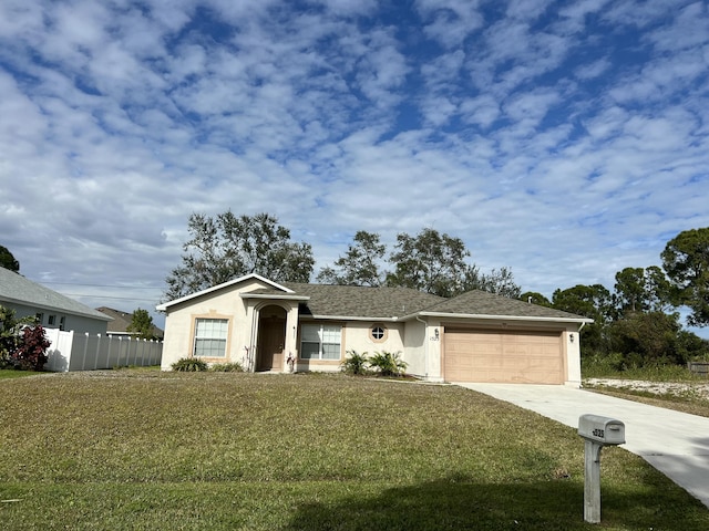 view of front facade featuring a front lawn and a garage