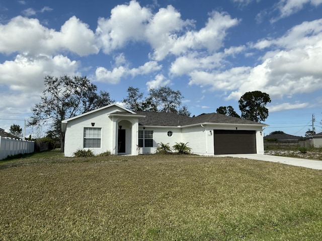 ranch-style house with a garage and a front yard