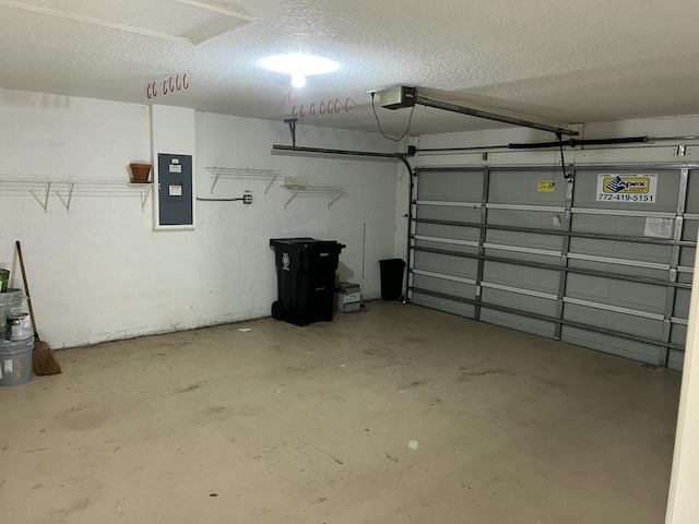 garage featuring a garage door opener and electric panel