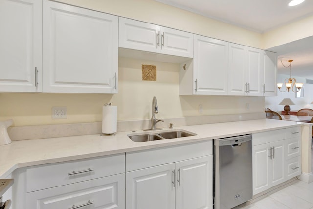 kitchen with dishwasher, white cabinets, hanging light fixtures, and sink