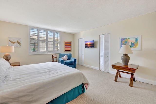 carpeted bedroom with a textured ceiling