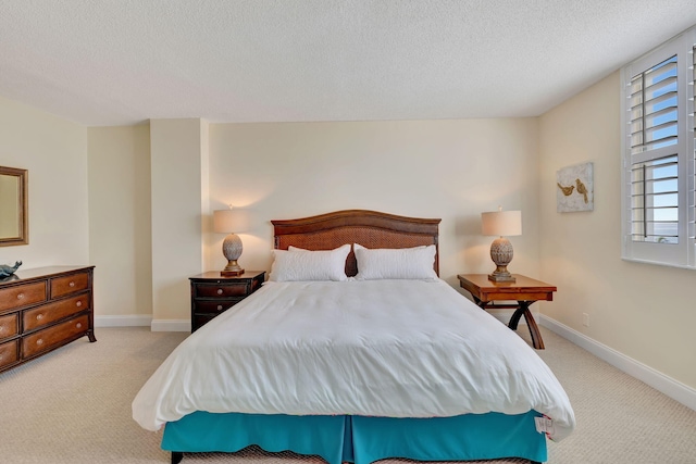 carpeted bedroom with a textured ceiling