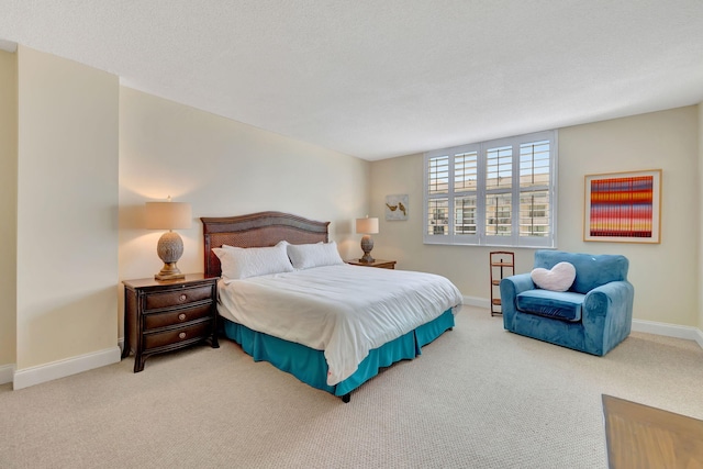 carpeted bedroom with a textured ceiling