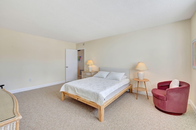 carpeted bedroom featuring a textured ceiling