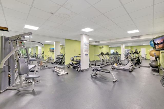 exercise room with a drop ceiling