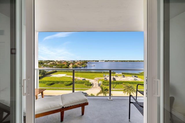 balcony featuring a water view