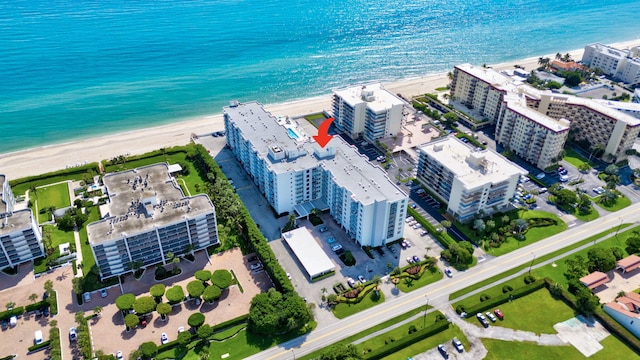 aerial view featuring a water view and a beach view