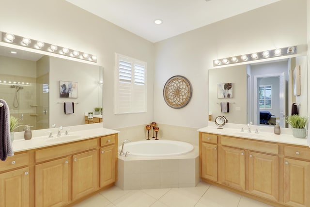 bathroom with tile patterned flooring, vanity, and independent shower and bath