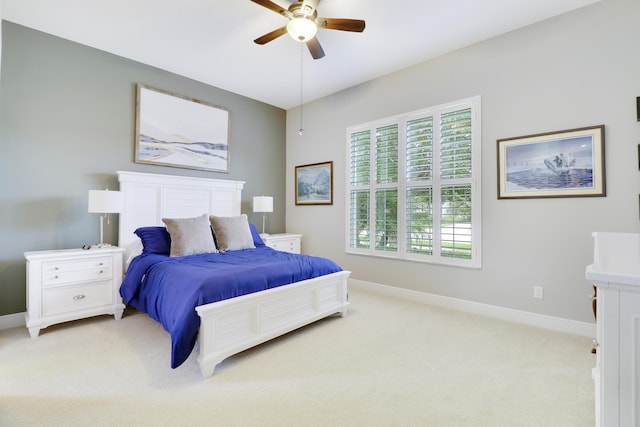 bedroom featuring ceiling fan and light colored carpet