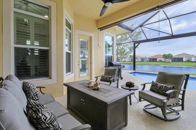 view of patio with an outdoor hangout area, a water view, ceiling fan, and a lanai