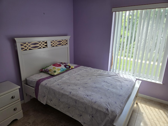 bedroom featuring tile patterned flooring