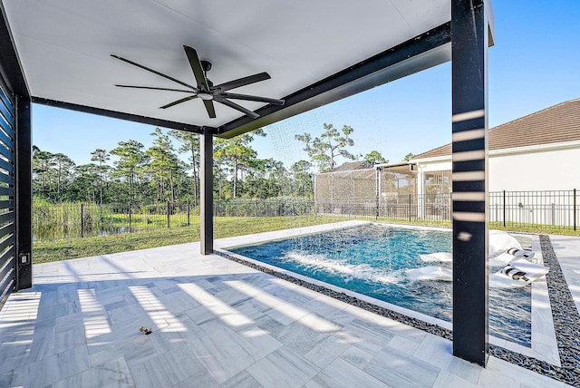 view of swimming pool with pool water feature, ceiling fan, and a patio area