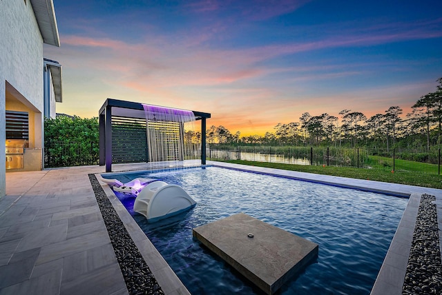 view of pool at dusk