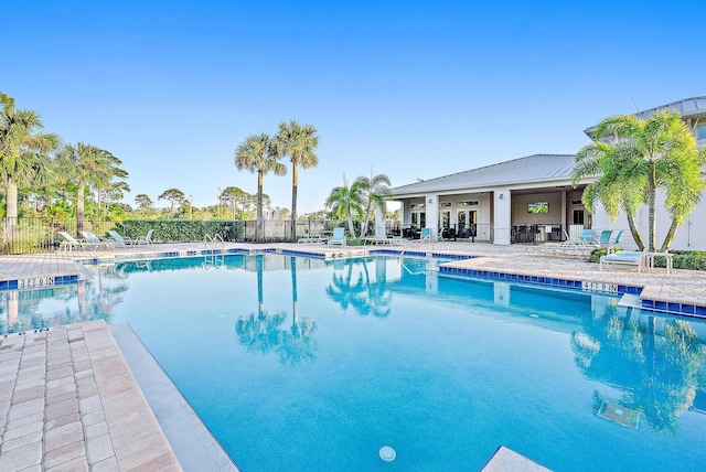 view of swimming pool with a patio area