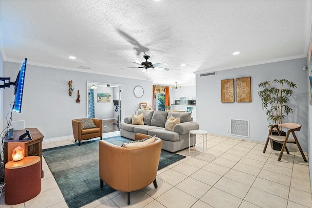 living room with ceiling fan with notable chandelier, light tile patterned floors, a textured ceiling, and ornamental molding