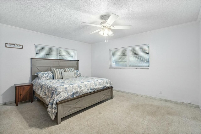 carpeted bedroom with ceiling fan, ornamental molding, and a textured ceiling