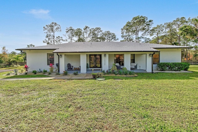 ranch-style home featuring a front yard