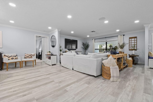 living room featuring ornamental molding and light wood-type flooring