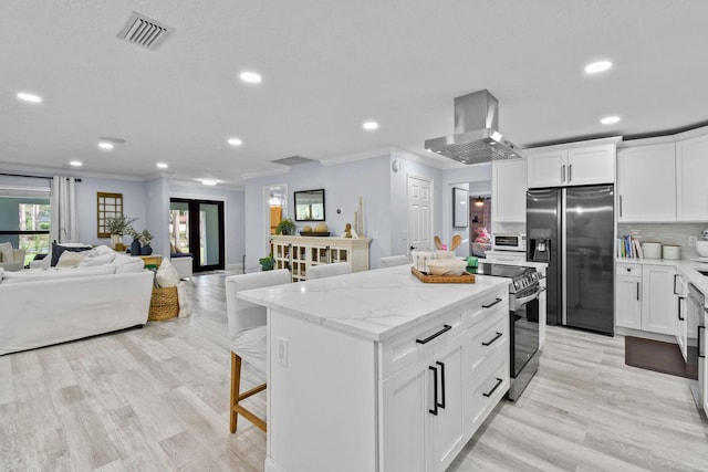 kitchen featuring appliances with stainless steel finishes, backsplash, a center island, white cabinets, and island exhaust hood